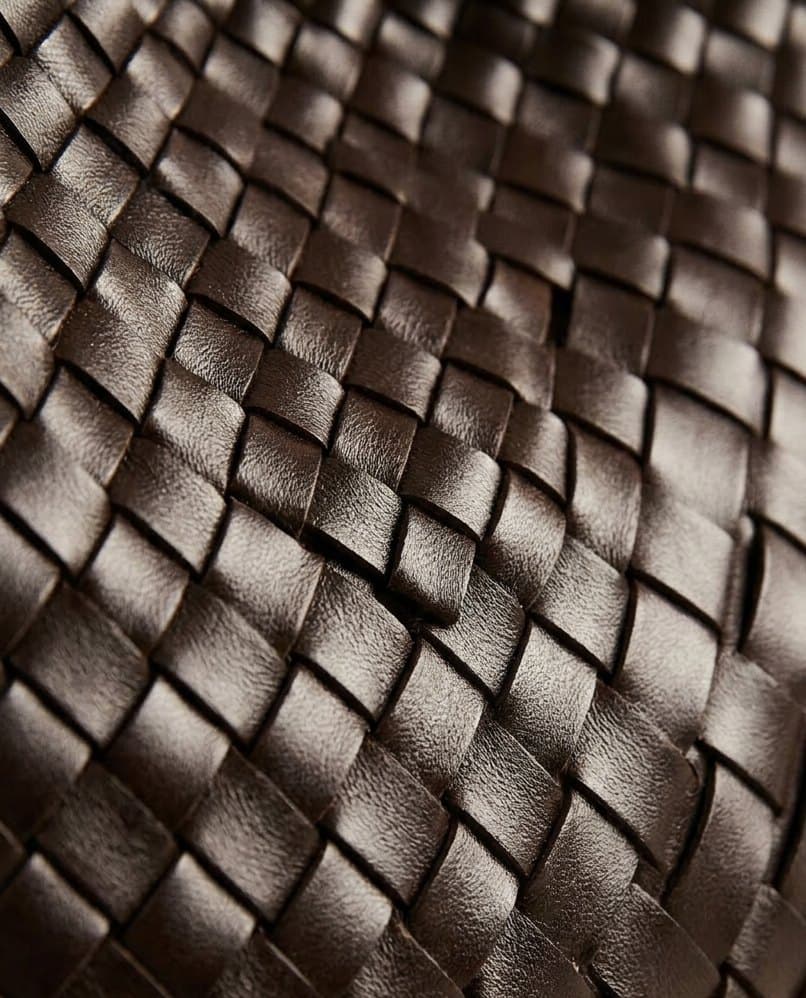 Close-up of the fine zigzag herringbone; knotted braided strap on the Luna